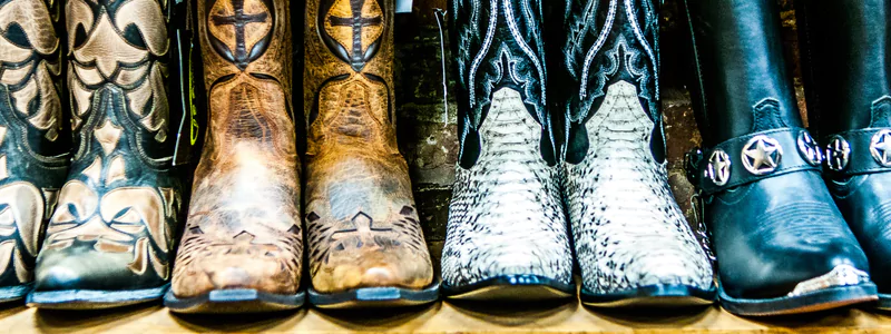 Custom-Made High Heels: Final Perfection 4 Various men's and women's cowboy boots with intricate embellishments, including ornate designs, studs, and faux leather motifs.