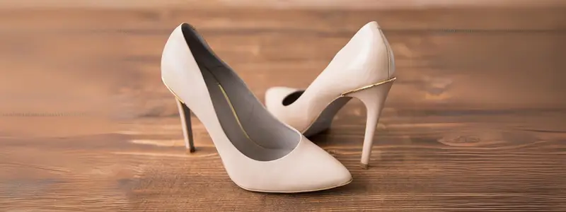 Eco-Friendly High Heels: Breaking Formula 3 Vegan stiletto heels in ecru color on a wooden floor.