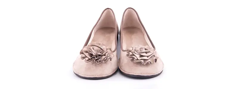 Historical powder pink loafers with a comfortable interior and a decorative attention-grabbing rose on the front.