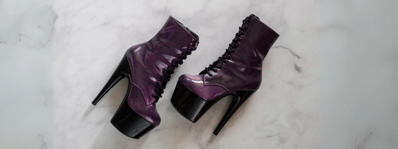 Purple high platform stiletto Pleaser shoes lying on the floor.