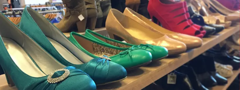 Colorful luxury high heels displayed on a boutique store shelf, highlighting premium designer stilettos in vibrant shades.