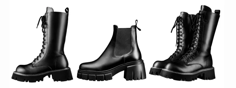 Luxury black leather high-heel boots with chunky platform soles, featuring bold designer craftsmanship and avant-garde stiletto-inspired footwear design. Heels For Men