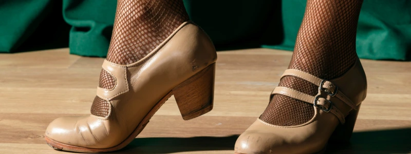 Beige Mary Jane heels with double buckle straps worn with fishnet tights, classic vintage unisex shoes.