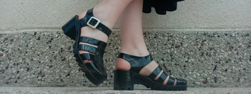 Black Mary Jane platform shoes with chunky heel and buckle strap worn on steps, stylish men & women’s retro footwear.